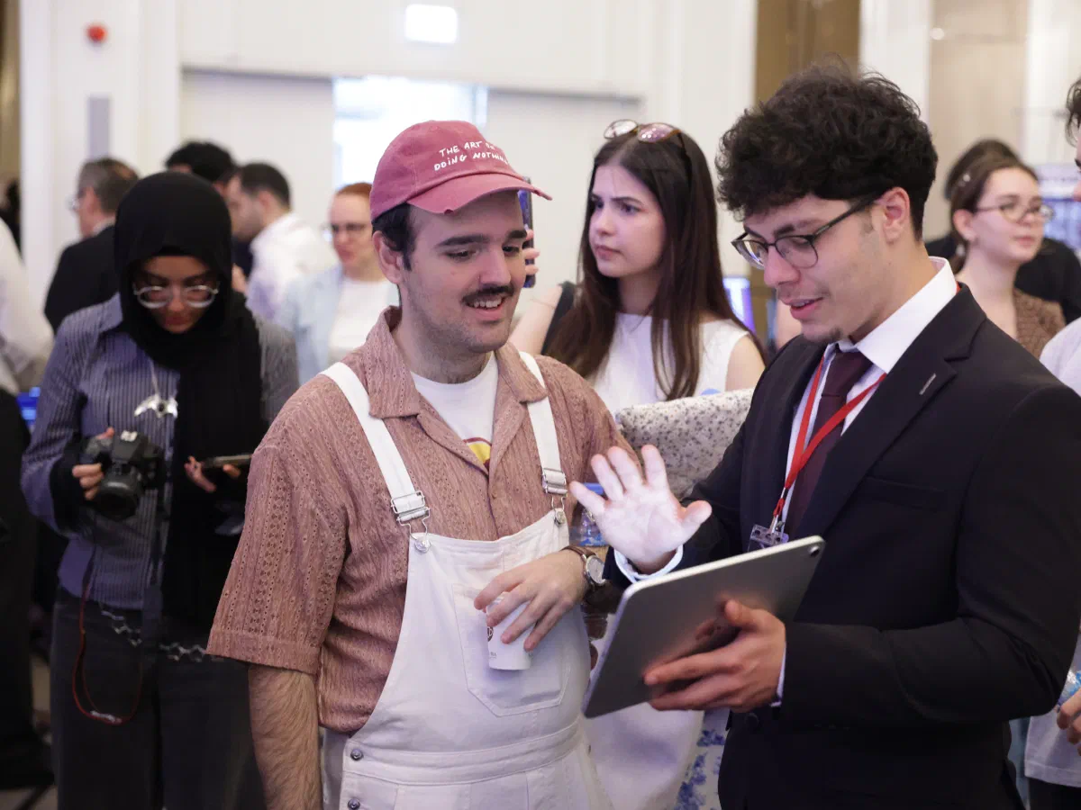 Students demonstrating their project to visitors